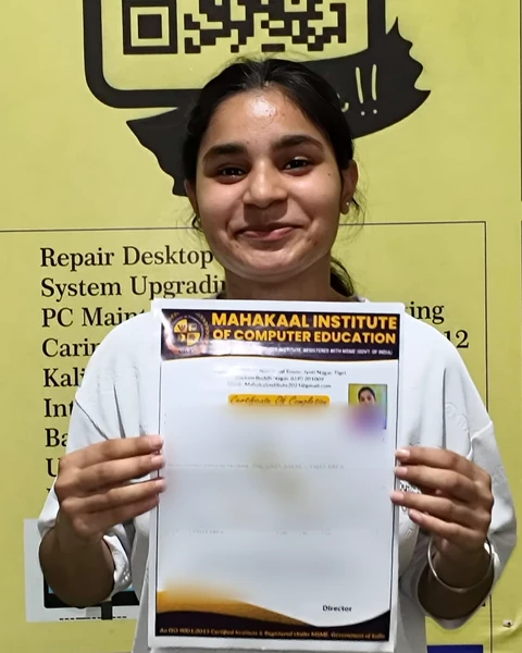 Student holding a course completion certificate at Mahakaal Institute
